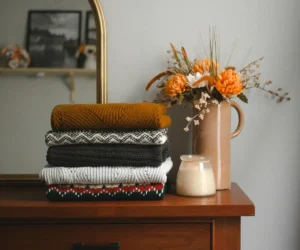 autumn clothes on a dresser with decorations