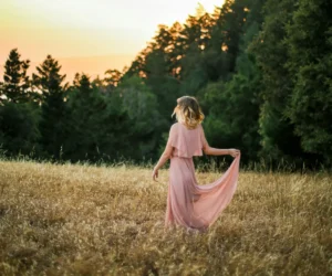 woman in pink dress in nature
