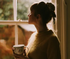 woman looking out of window