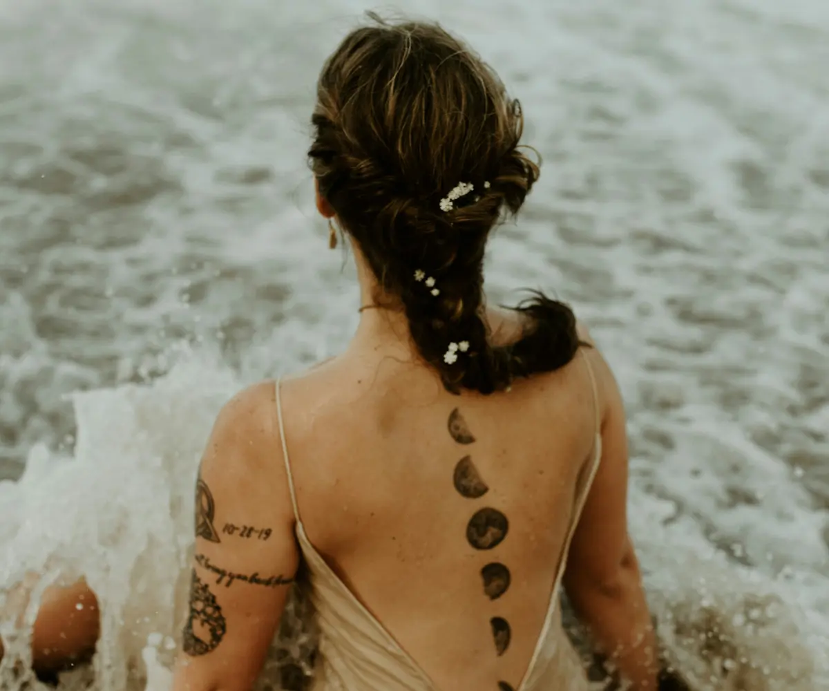 woman with moon tattoo