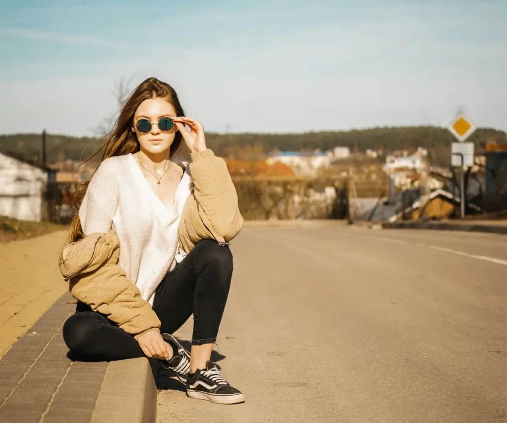 woman sitting on the road