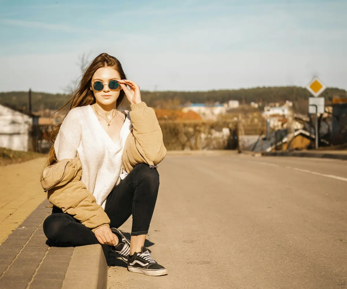 woman sitting on the road
